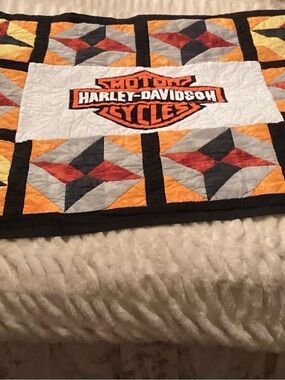 custom Harley-Davidson quilt features a central brand logo